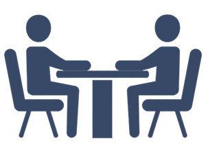 A blue icon of two people sitting at a table for an interview