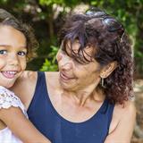 Australian Aboriginal Woman Hugging Her Granddaughter Australian Aboriginal Woman Hugging Her Granddaughter