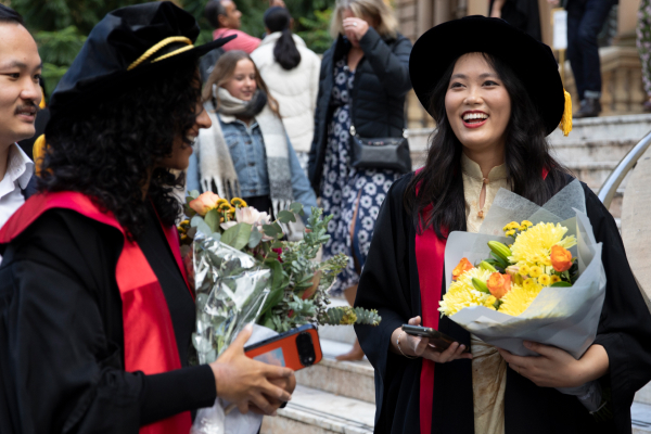 A woman singing on stage during the 2025 RACP College Ceremony in Sydney.