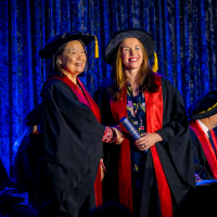 Graduate on stage at Perth Ceremony accepting Fellowship