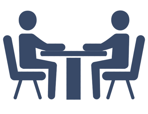A blue icon of two people sitting at a table for an interview