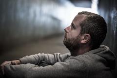 Homeless-adult-male-sitting-in-subway-tunnel-begging-for-money-612508406_5472x3648