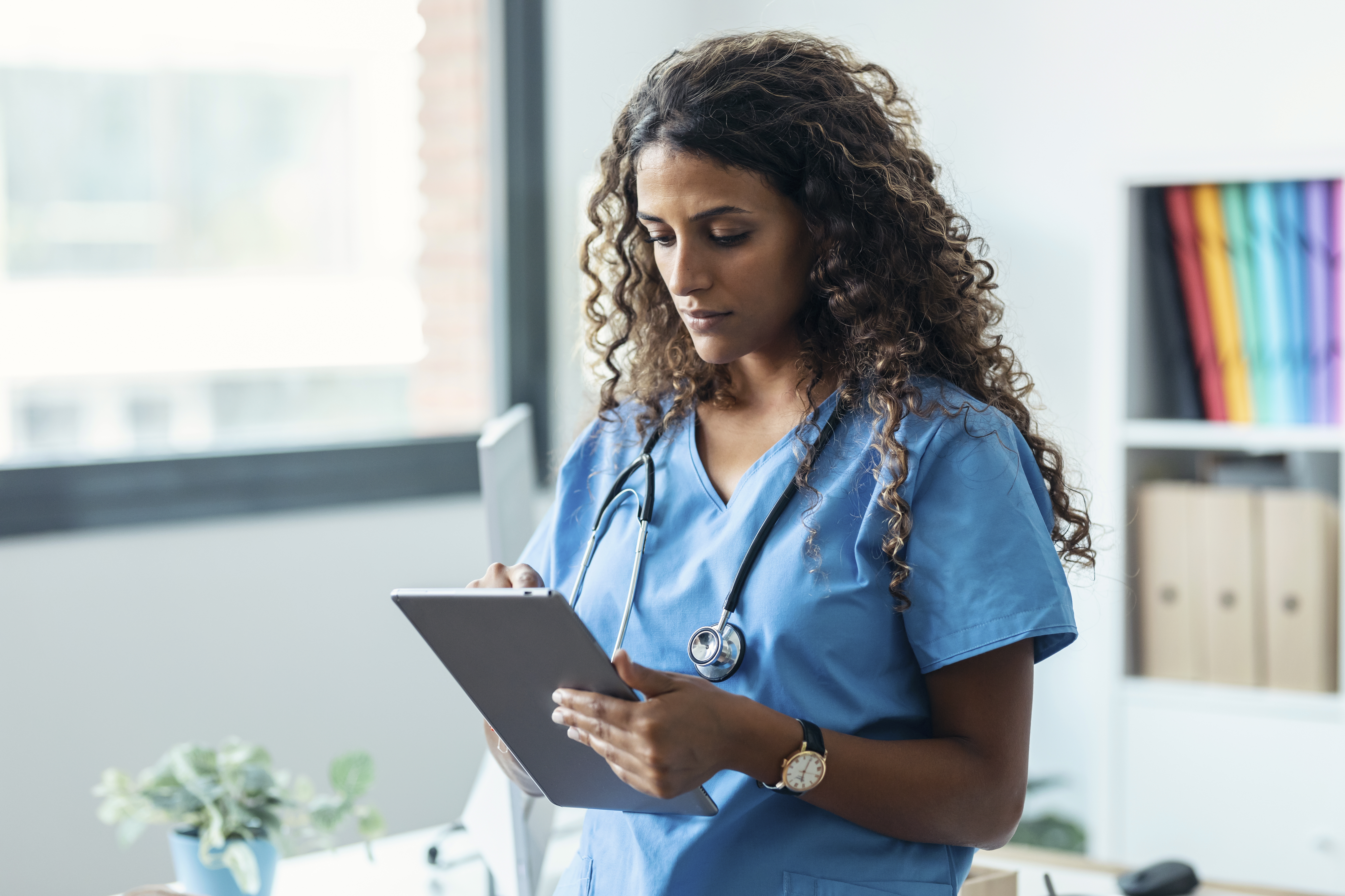 doctor looking at clipboard