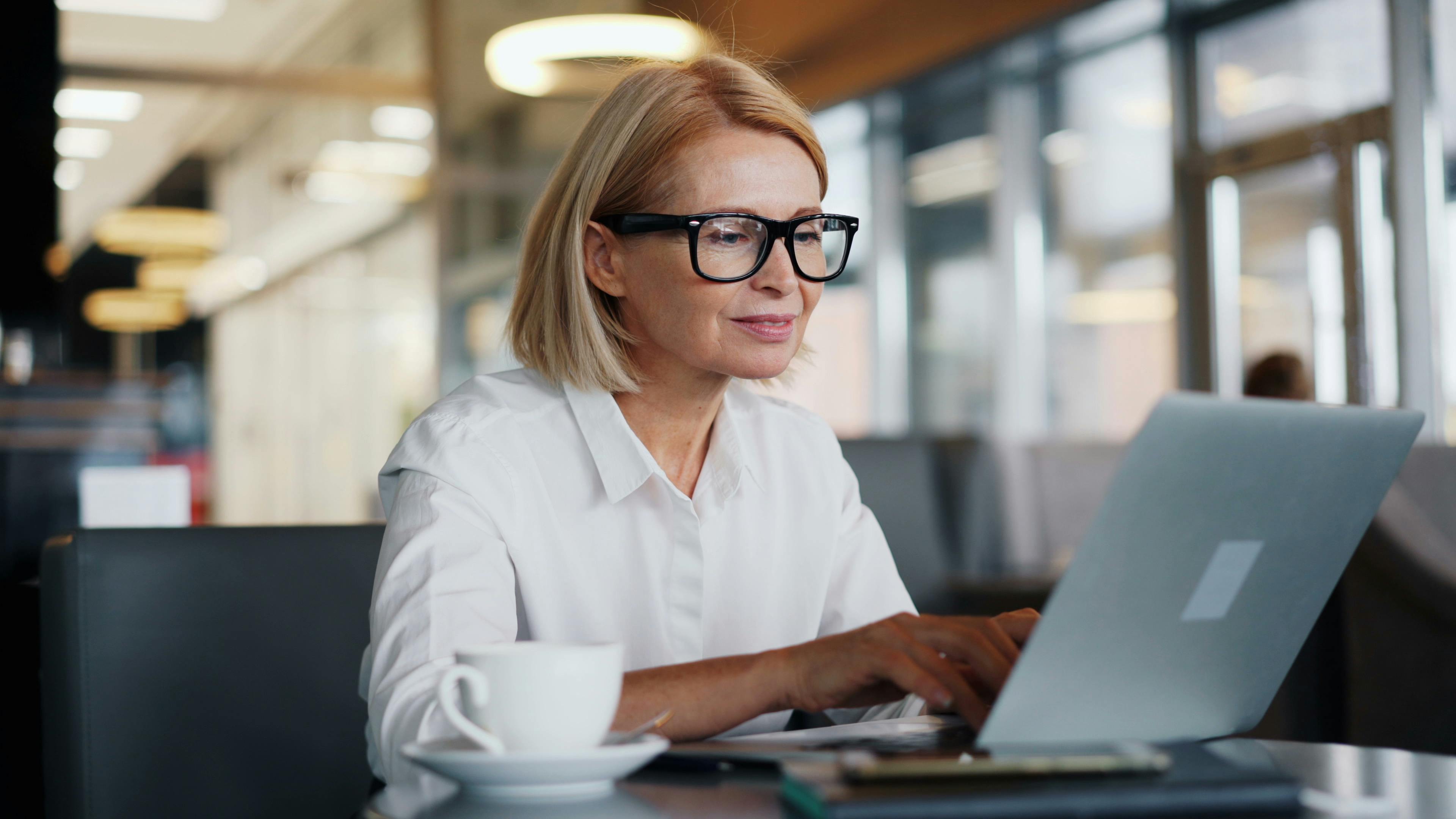 woman typing on laptop