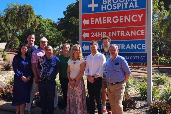 President Jeniffer Martin standing with three trainees in a rural Western Australia setting.