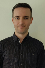 A photograph of Alex Brebner