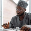 Male doctor sitting at desk working Male doctor sitting at desk working